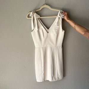 Never worn white dress with bows on straps by Amanda Uprichard in size small.